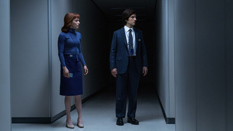 Helly R. and Mark S. standing in a hallway looking confused in Severance season 2