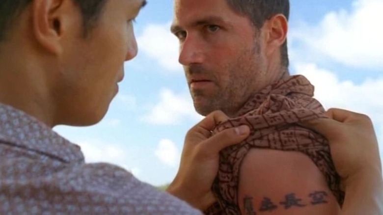 Matthew Fox as Jack Shepard showing off his infamous tattoos in a scene from Lost