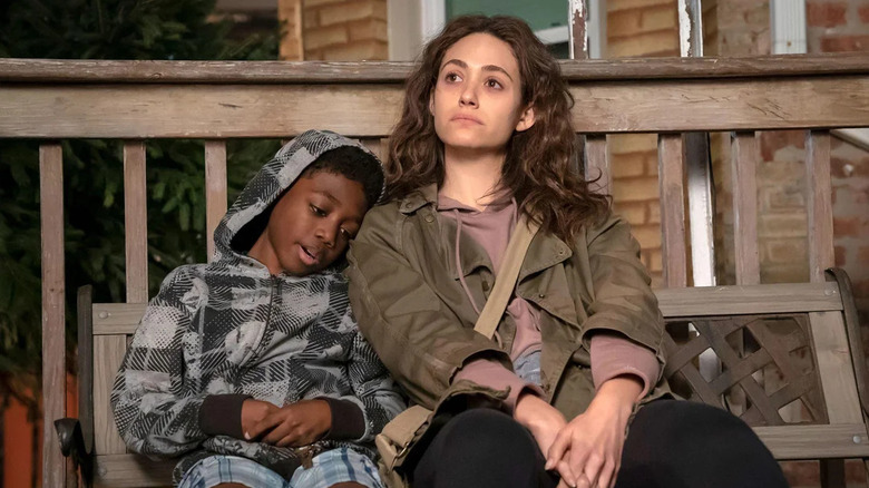 Liam sitting with Fiona on a porch in Shameless