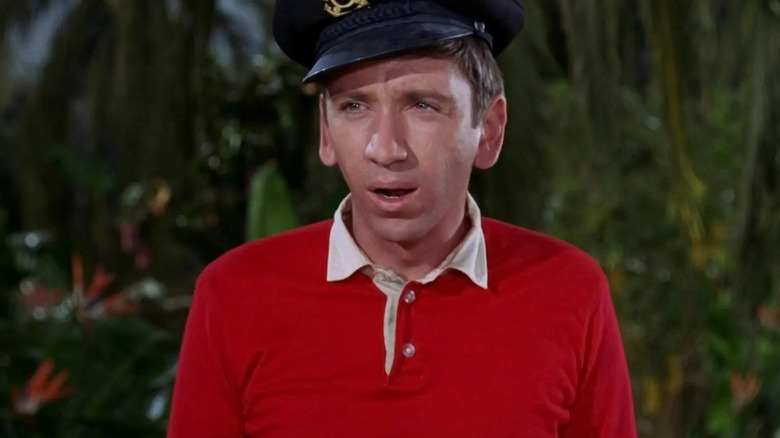 Gilligan wearing a captain's hat and looking confused in Gilligan's Island