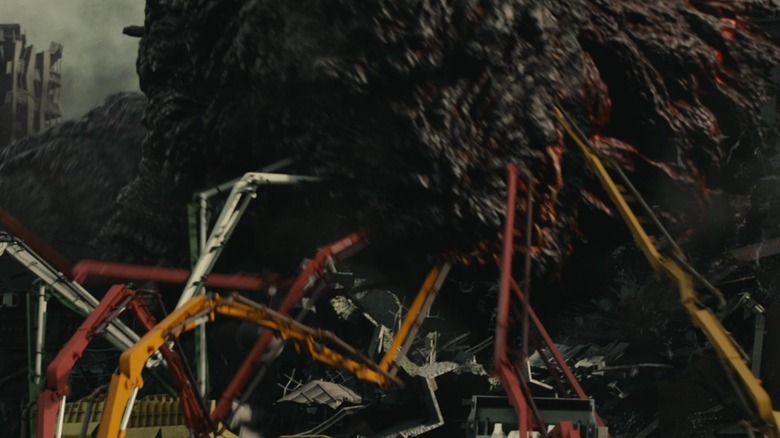 Shin Godzilla red and yellow cranes pump coolant into godzilla's mouth