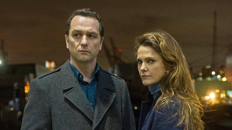 Matthew Rhys and Keri Russell stare intently