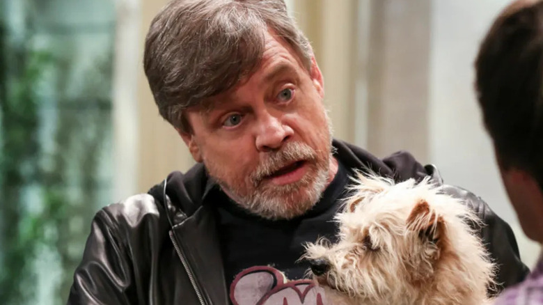 Mark Hamill holding Bark Hamill in front of Howard on The Big Bang Theory