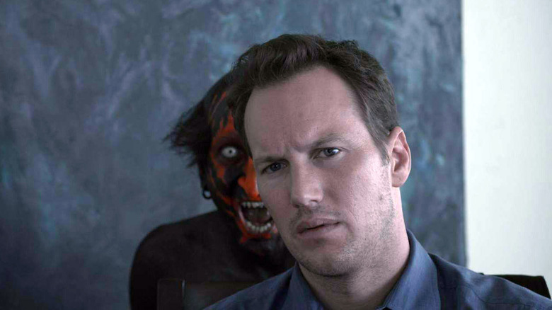 Lipstick-Faced Demon standing Patrick Wilson in Insidious