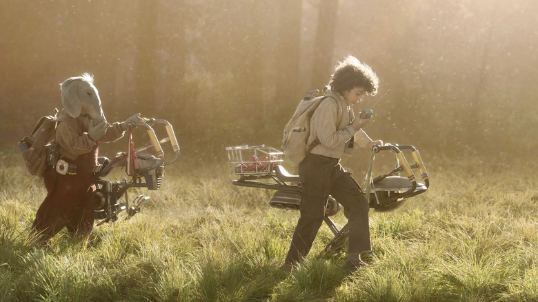 Neel and Wim walking through a sun-dappled meadow in Star Wars: Skeleton Crew