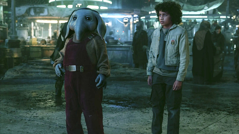 Robert Timothy Smith as the elephant-esque alien Neel and Ravi Cabot-Conyers as the human Wim lost in a Cantina on a mysterious planet in Skeleton Crew