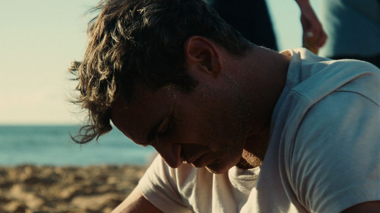 Joaquin Phoenix at the beach in The Master