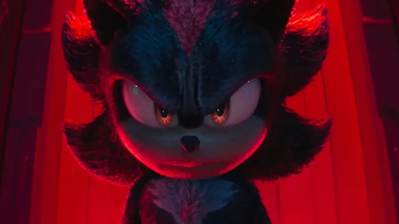 Shadow glares in red lighting in Sonic the Hedgehog 3