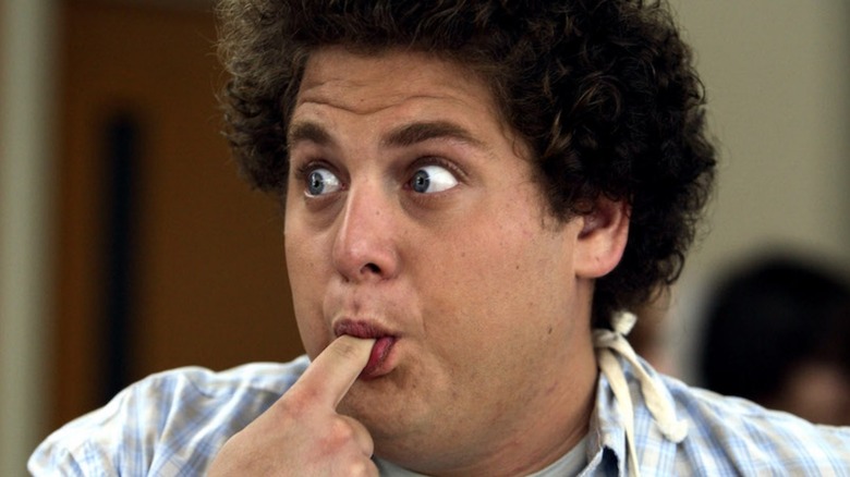 Jonah Hill sucks on his finger as Seth in Superbad