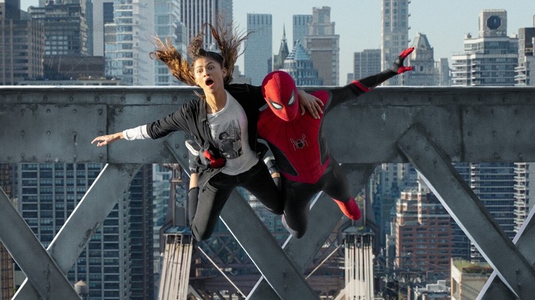 shocked girl being held by spiderman as they glide in the air