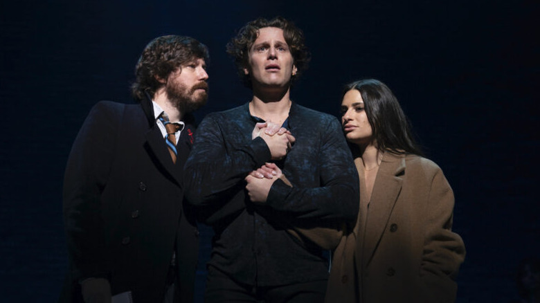 jonathan groff holding john gallagher jr and lea michele's hands against his chest in spring awakening