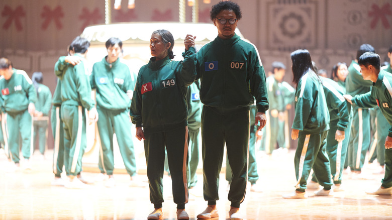 Kang Ae-sim as Jang Geum-ja and Yang Dong-geun as Park Yong-sik in Squid Game season 2