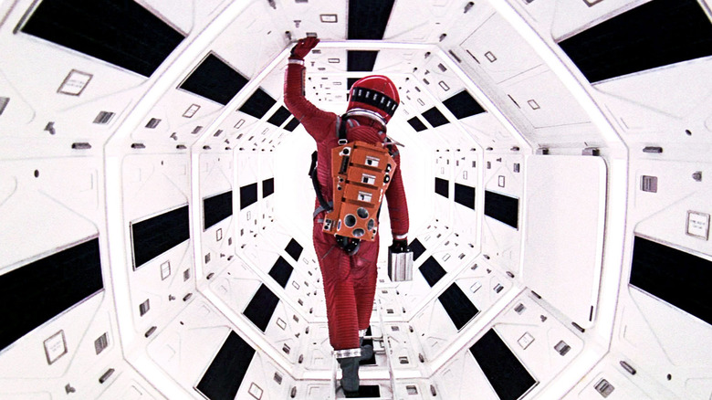 Dave walking down a spaceship hallway in 2001: A Space Odyssey