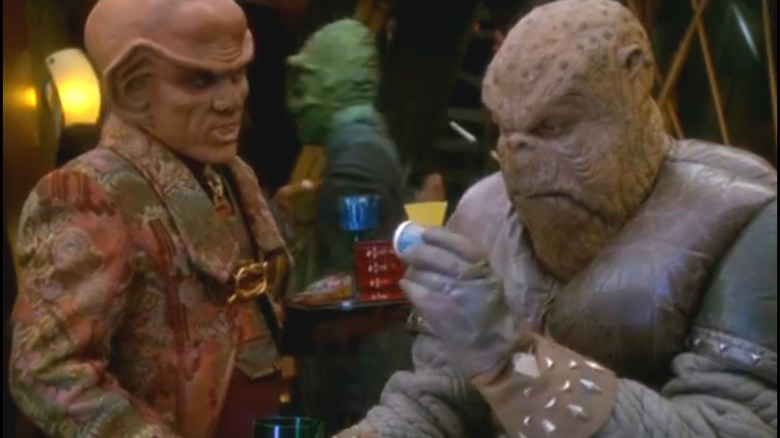 Armin Shimerman as Quark and Mark Allen Shepard as Morn on Star Trek: Deep Space Nine