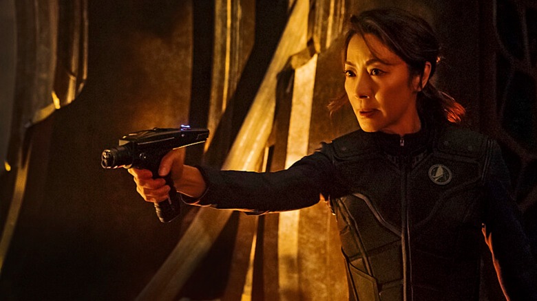 Michelle Yeoh points a phaser in Star Trek: Discovery