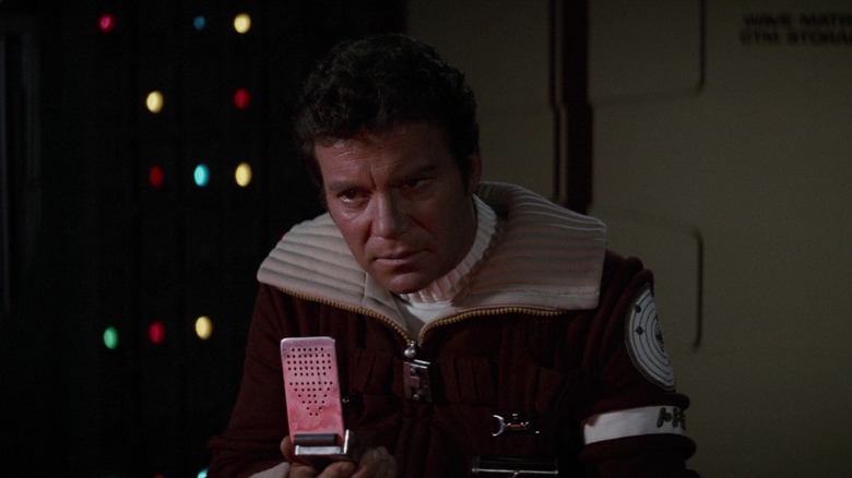 Admiral Kirk talking into a communicator in Star Trek II: The Wrath of Khan