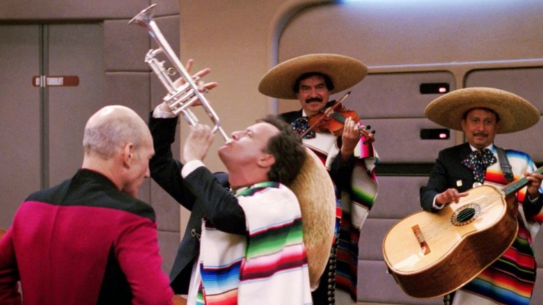 Q plays with mariachi band