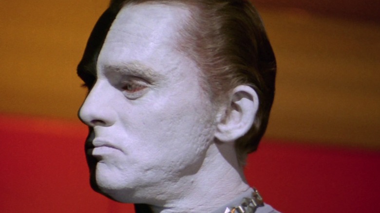 A close-up of Frank Gorshin's Bele, the pale white side of his face towards the camera, in Star Trek: The Original Series