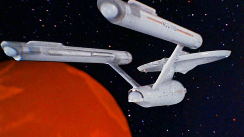 Star Trek Enterprise orbits a planet