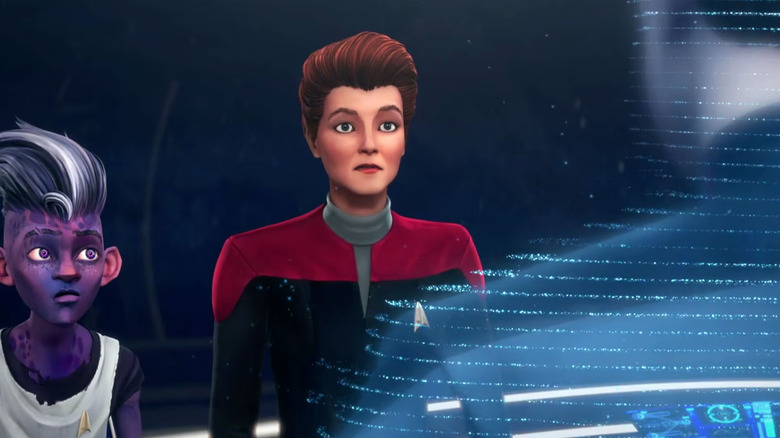 Dal and Hologram Janeway looking at another hologram on the bridge of the Protostar on Star Trek: Prodigy.