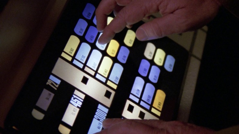 Pair of hands on a computer panel of the ship's USS Enterprise-D in the Star Trek franchise