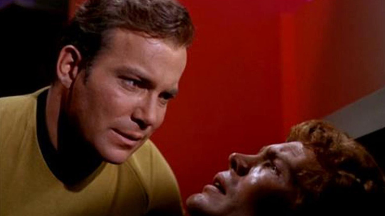 Kirk (William Shatner) interrogates a dying Rizzo (Jerry Ayres) in Star Trek: The Original Series