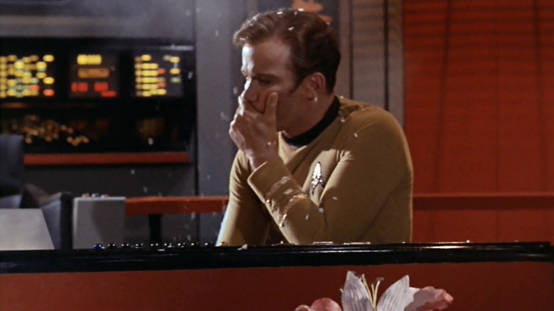 Kirk (William Shatner) is sprayed by spores in Star Trek: The Original Series