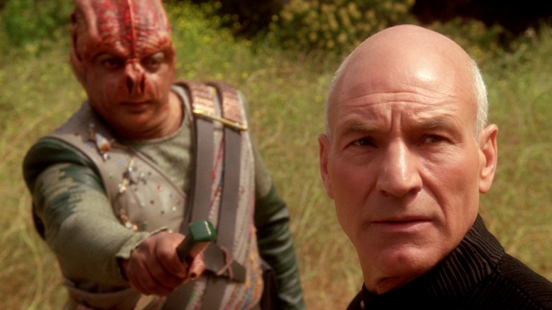 The Tamarian captain (Paul Winfield) holds out a knife to Picard (Stewart) in TNG's Darmok