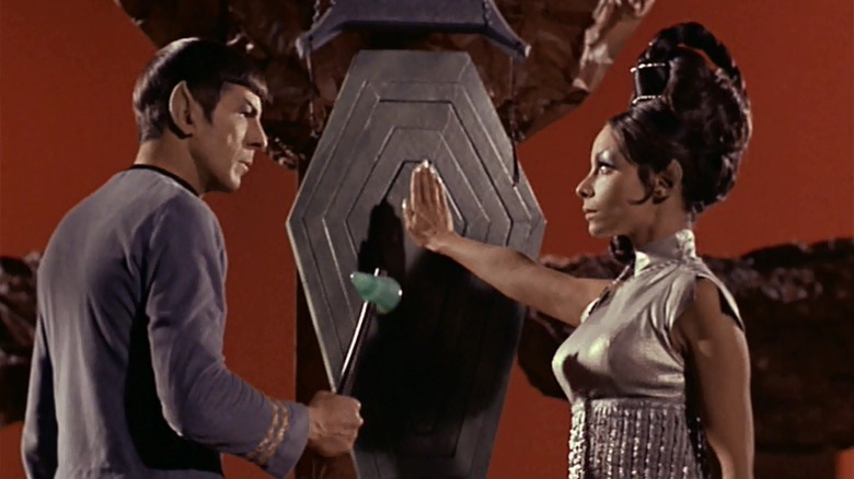 T'Pring (Arlene Martel) stops Spock (Leonard Nimoy) from hitting a gong in Star Trek: The Original Series