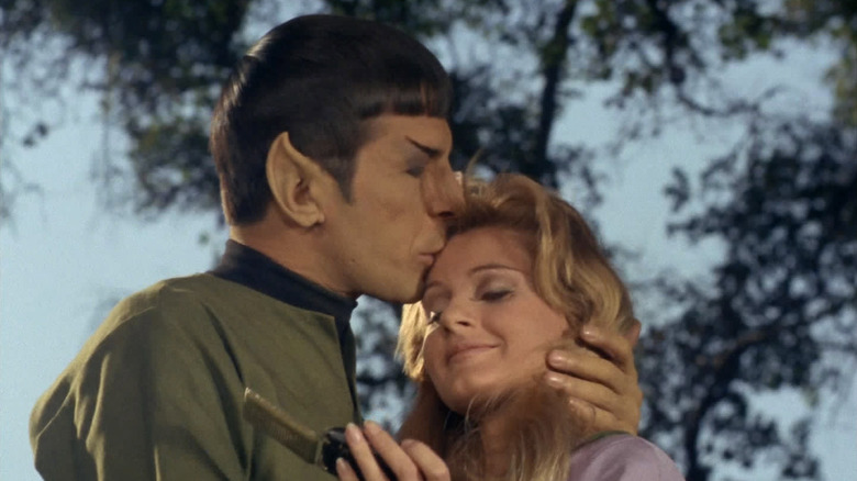 Spock (Leonard Nimoy) kisses Leila (Jill Ireland) on the forehead in Star Trek: The Original Series