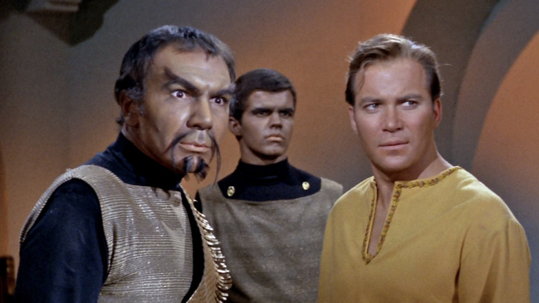 Kor the Klingon and Captain James Kirk together, looking at something offscreen