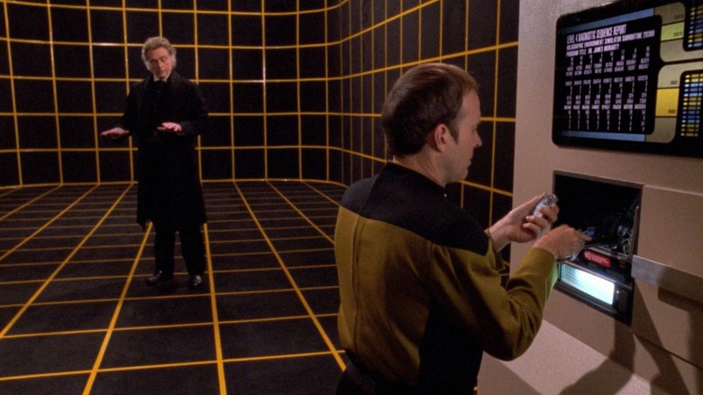 Lieutenant Barclay working on a holodeck panel. A man in period clothes is standing in the holodeck behind him.