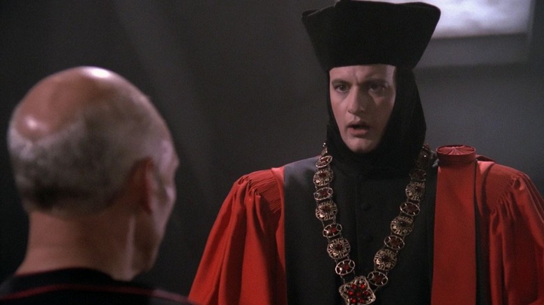 Q, dressed as a future judge, talking to Captain Picard in Star Trek: The Next Generation