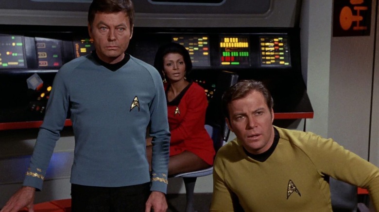 DeForest Kelley, Nichelle Nichols, and William Shatner on Star Trek: The Original Series