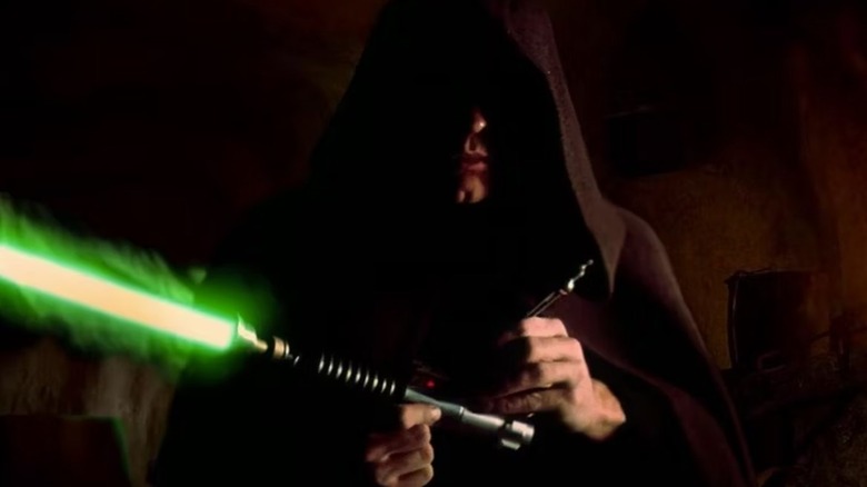 Luke holding lightsaber