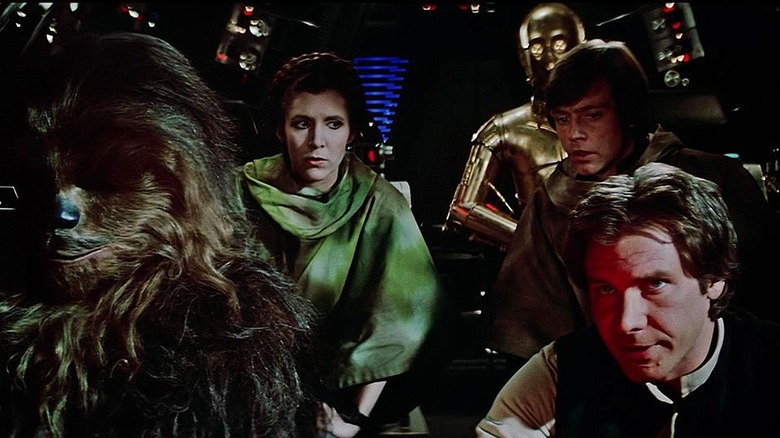 Chewie, Leia, C-3PO, Luke, and Han in the cockpit of the stolen Imperial shuttle in Star Wars: Return of the Jedi