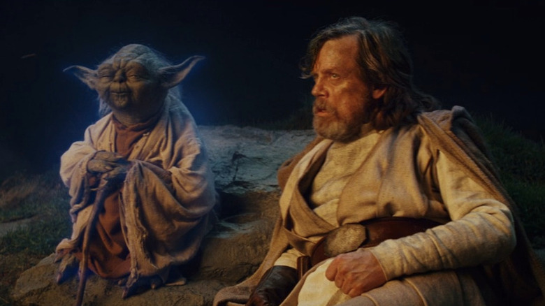 Yoda sitting with Luke Skywalker