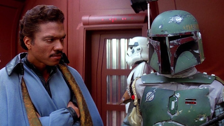 Billy Dee Williams as Lando Calrissian eyes Boba Fett suspiciously in Star Wars: Episode V - The Empire Strikes Back