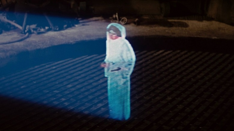 Carrie Fisher as Princess Leia delivers a hologram message in Star Wars: Episode IV - A New Hope