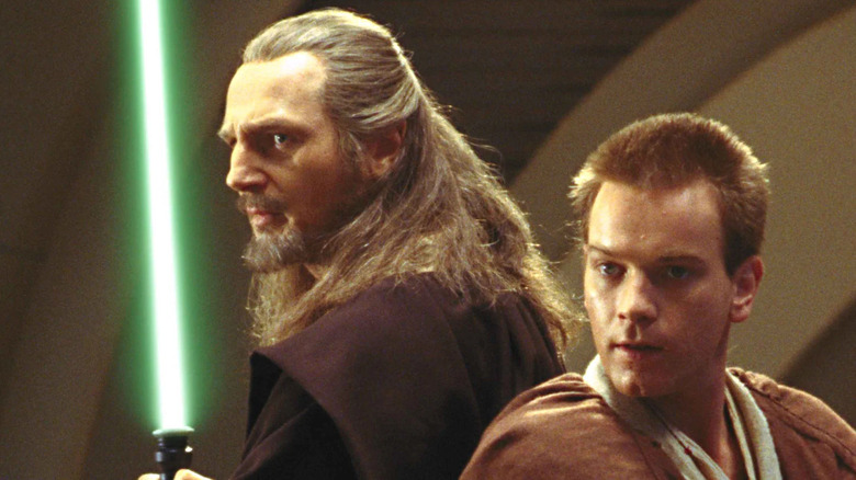 Obi-Wan and Qui-Gon, back to back, lightsabers at the ready