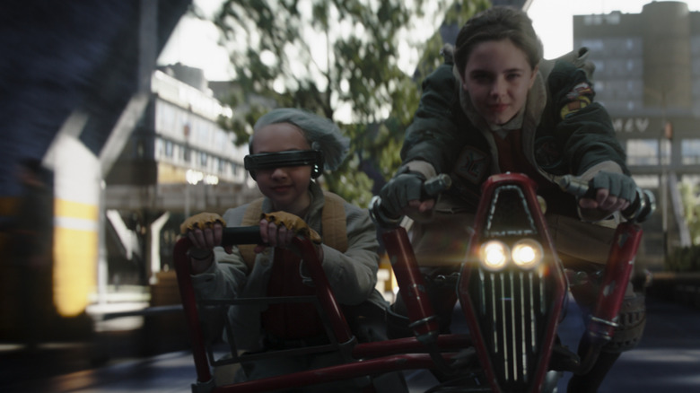 KB riding alongside Fern on a speeder bike in Star Wars: Skeleton Crew