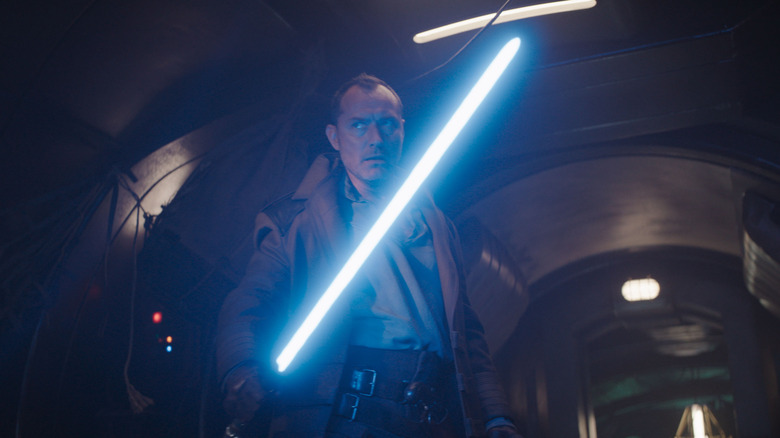 Jude Law's Jod holding a lightsaber on Star Wars: Skeleton Crew