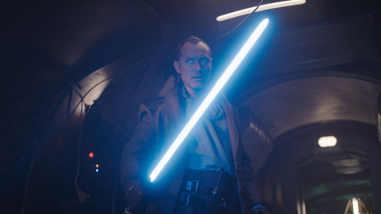 Jod holds a lightsaber in Skeleton Crew