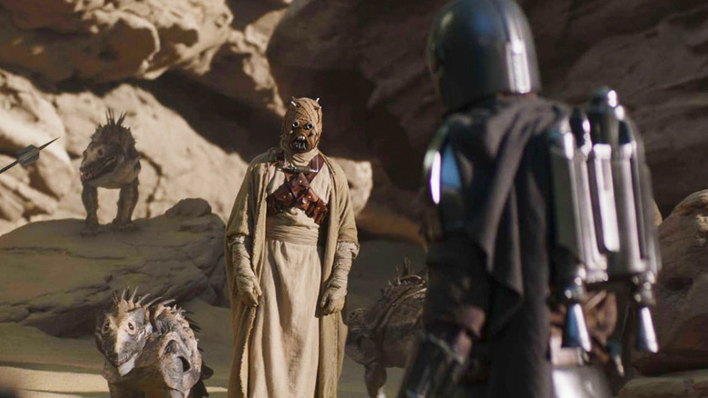 Din Djarin (Pedro Pascal) faces off with a Tusken Raider