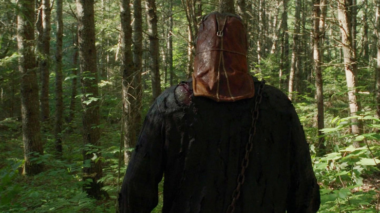 Ry Barrett as Johnny trudging through the forest in In a Violent Nature