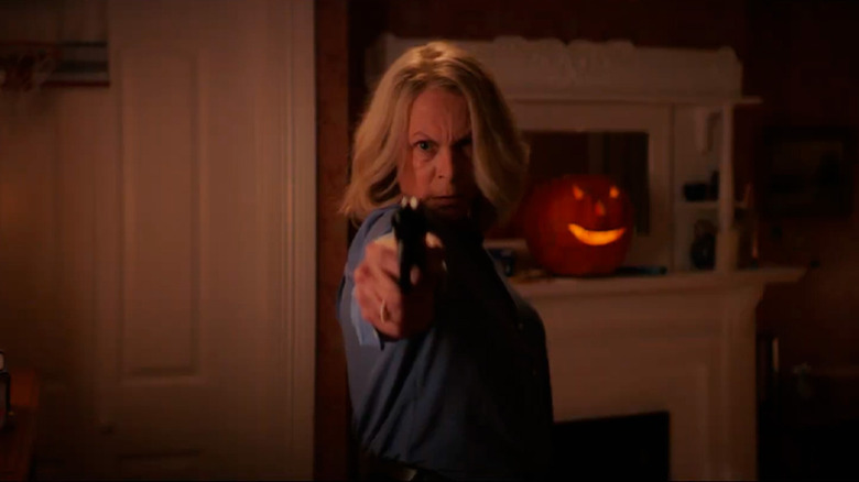 Laurie Strode pointing a gun in Halloween Ends