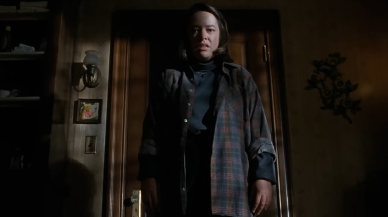 Kathy Bates, as Annie Wilkes, standing by the doorway in "Misery".