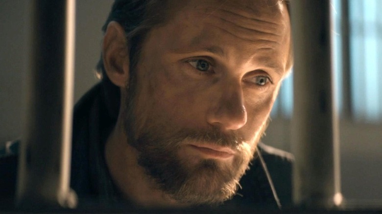 Randall Flagg (Alexander Skarsgard) visits a prisoner in The Stand