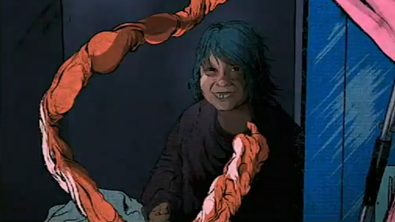 A comic drawing of a boy crouching in the corner, smiling at a dangling intestine. From Creepshow: RAW.