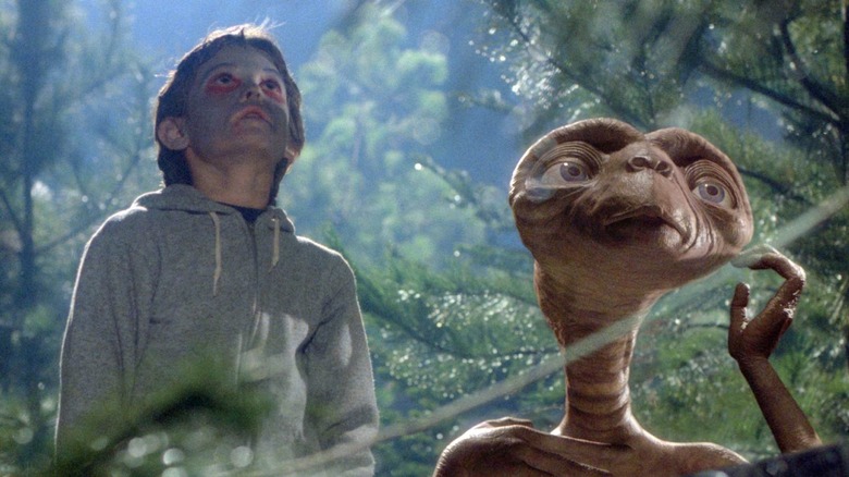 Elliott and E.T. looking up